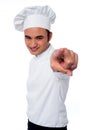 Smart young chef pointing at camera cool male you out Royalty Free Stock Photo