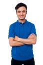 Smiling smart guy posing with confidence confident young man looking at camera arms crossed Stock Photography