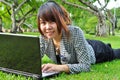 Smiling Woman With Laptop In N...