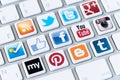 Social media buttons a logotype collection of well known network brand s placed on modern computer keyboard Royalty Free Stock Photo