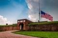 Summer storm clouds and American flag over Fort McHenry in Balti