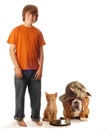 Teen boy with pet dog and cat