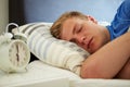 Teenage Boy Sleeping Through Alarm