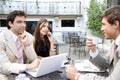 Business People Meeting In Cafe.