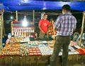 Tourist buying items from a hawker in Puri beach Royalty Free Stock Photography