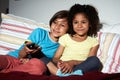 Two Children Sitting On Sofa W...