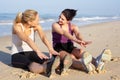Two Women Exercising On Beach