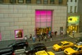 Victoria s secret storefront people walking on the sidewalk in front of the during rush hour traffic and yellow taxicabs Stock Image