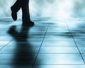 Walker editable vector illustration of a man walking across a tiled floor made using a gradient mesh Stock Photos
