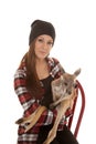 Woman in beanie and plaid shirt baby kangaroo look