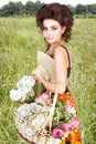 Woman With Flowers In The Field