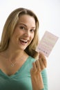 Woman Holding Lottery Ticket