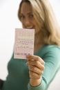 Woman Holding Lottery Ticket