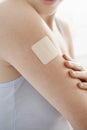 Woman With Nicotine Patch On Arm