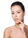 Woman touching her lips Stock Photography