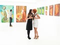 Women Gossiping In Art Gallery