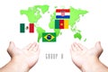 World Cup 2014 Group-A Flag with Hand and World Map background