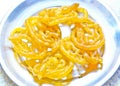 Yellow colored Indian sweet, Jalebi. Royalty Free Stock Photos