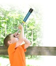 Boy Exploring Nature In The Wo...