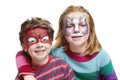 Young boy and girl with face painting cat and spiderman
