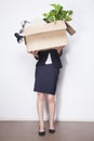 Young Businesswoman Holding Bo...