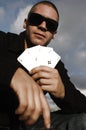 Young caucasian man with ace cards Royalty Free Stock Photo - young-caucasian-man-ace-cards-playing-outside-41684108