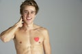 Young Man With Heart Shaped Sy...