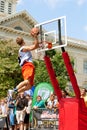 Young Man Jumps Above Rim In Outdoor Slam Dunk Contest