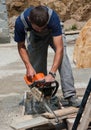 Young worker with saw Stock Image