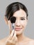Beautiful Asian woman with make-up brushes