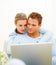 Loving couple working on a laptop together