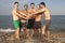 Male friends having fun on the beach