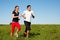 Sport couple jogging outdoors in summer