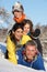 Young Family Having Fun In Snowy Landscape