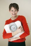 Attractive Woman Holding a Bathroom Scale Stock Images