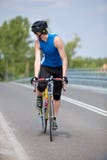 Biker race bike looking behind Stock Image