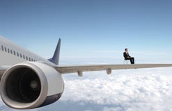 businessman-plane-sitting-chair-over-s-wing-31800827.jpg