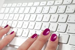 http://thumbs.dreamstime.com/t/female-fingers-touching-white-metal-keyboard-18931127.jpg