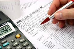 Filling out tax form Royalty Free Stock Photography