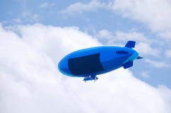 Flying blimp with blank advertising sign area Royalty Free Stock Image