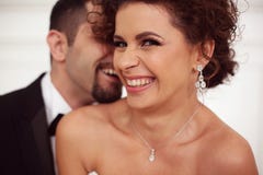 Happy bridal couple Stock Photos - happy-bridal-couple-smiling-embracing-58203963