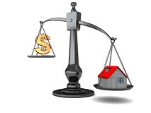 House and money on scale Royalty Free Stock Photography