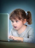 Little girl with laptop Royalty Free Stock Photo