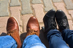 Male & female legs in boots Stock Photography