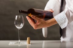 man-waiter-pouring-wine-glass-male-butler-serving-43891153.jpg