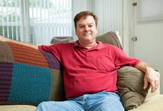 Mid Adult Man Relaxing at Home Stock Image