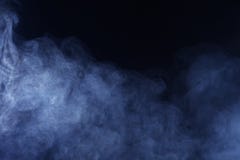 在黑背景的蓝色/灰色烟 免版税图库摄影