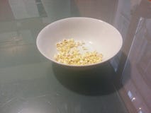 popcorn-frosted-glass-table-image-semi-empty-bowl-45391066.jpg