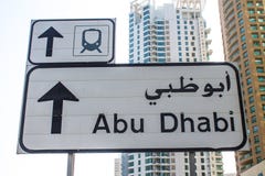 road-sign-dubai-street-showing-direction-to-abu-dhabi-50633256.jpg