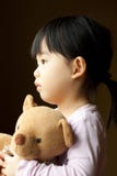 Sad little girl with teddy bear Royalty Free Stock Photos - sad-little-girl-teddy-bear-13740008